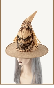 Close-up of burlap scarecrow wizard hat featuring raffia trim and printed spooky face
