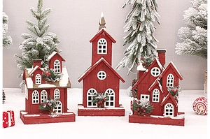 Three red wooden Christmas houses with white snow finish and pine needle detail