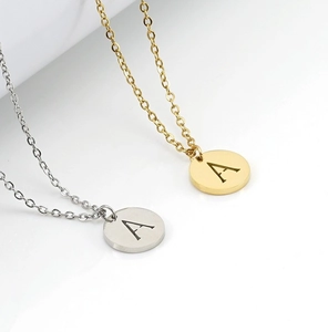 Detailed view of 18K gold and silver plated titanium steel alphabet A pendant necklaces