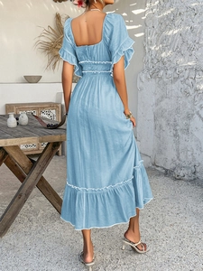 Detail of square open back and ruffled sleeves on a blue Bohemian dress