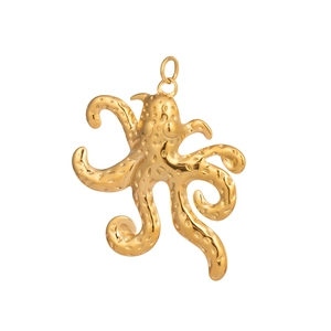 Macro detail of 18K gold-plated stainless steel octopus pendant with dotted texture