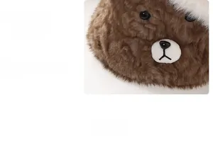 Detailed view of brown faux rabbit fur bucket hat with cute puppy embroidery and brim design
