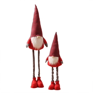 Large red and grey faceless Christmas gnomes in various sizes for holiday home decoration