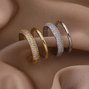 Double-layer micro-pave zircon open rings in gold and silver finish on silk fabric