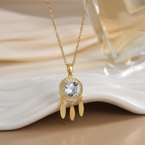 Golden dreamcatcher pendant necklace with sparkling cubic zirconia and leaf charms