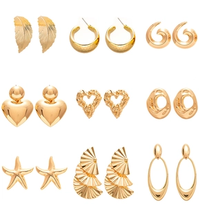 9-piece gold geometric earring set featuring starfish, heart, and textured metal designs