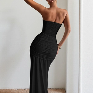 Back view of a sleek black off-the-shoulder evening gown featuring detailed ruched texture