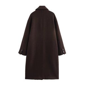 Deep brown long wool coat with oversized silhouette and tailored back vent details