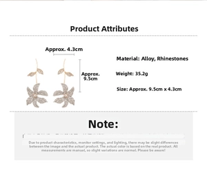 Detailed view of flower and leaf drop earrings with sparkling rhinestones and measurements