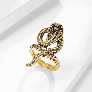 Detailed gold cobra snake ring in titanium steel with intricate scale texture and coiling design