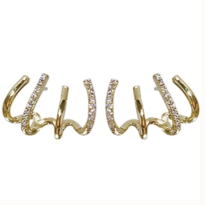 Elegant gold-tone four-claw stud earrings featuring sparkling pavé cubic zirconia accents