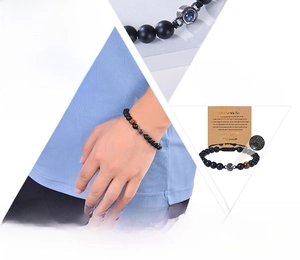 Macro detail of natural stone bracelet with projection stone and son message card