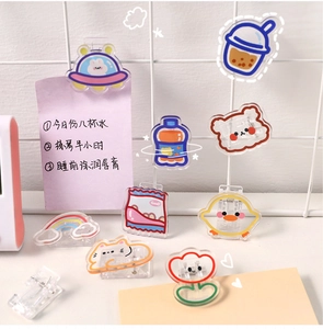 Cute acrylic cartoon clips set for paper and snacks organization on a white grid shelf
