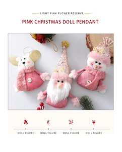 Detailed view of pink Christmas doll pendants with sequins and plush fabric textures