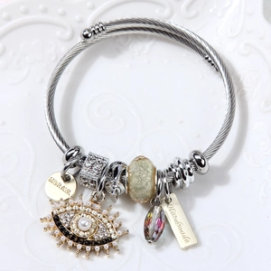 Silver twisted stainless steel bangle with evil eye charm, pearls, and Morava engraving