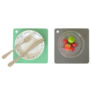 Square honeycomb silicone trivet set in light green and gray for kitchen heat protection