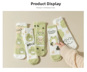 Detail of five pairs of warm green frog mink fleece socks with soft cartoon patterns