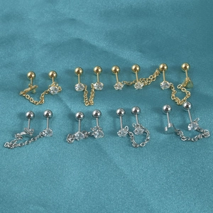 Set of stainless steel ear studs with stars, hearts, crosses and chains in gold and silver
