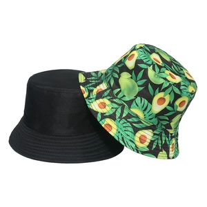 Close-up of black cotton bucket hat and white bucket hat with avocado fruit print