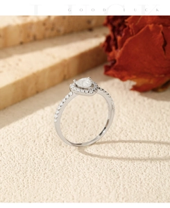 Macro shot of S925 sterling silver ring with heart-shaped moissanite and halo stones