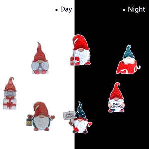 Reflective Christmas gnome magnets showing clear day versus night visibility details
