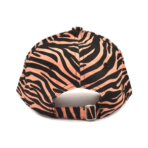 Close-up of pink and black zebra print baseball cap with adjustable silver metal buckle