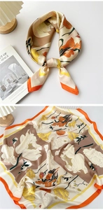 Close-up of floral print satin scarf with tulip patterns in champagne and orange tones