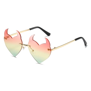 Fashionable rimless devil horn heart sunglasses with red-yellow-green gradient lenses