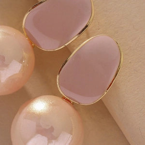 Elegant rabbit ear pearl earrings with pink enamel and gold-plated geometric accents