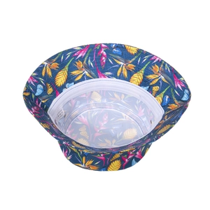 Detail of tropical floral sun hat with breathable white mesh lining and paradise bird print