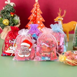 Colorful organza Christmas drawstring bags featuring festive snowman and holiday prints