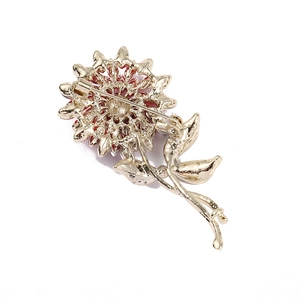 Golden flower sunflower brooch with red enamel petals and safety pin backing detail