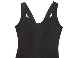 Detail of wide straps and V-neckline on a tight black bodycon dress for women