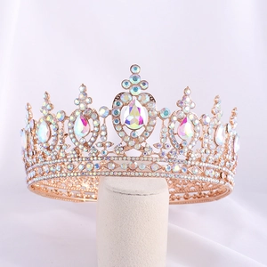Detail of rose gold bridal crown featuring colorful rhinestones on a display stand