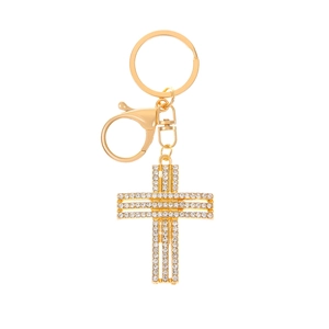 Detail of a gold cross keychain with rhinestones, showing lobster clasp and polished finish