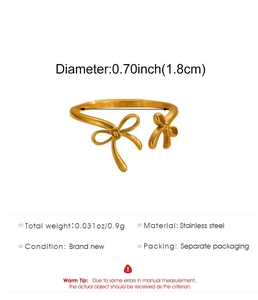 Detail view of gold stainless steel bow ring showing 1.8cm diameter and 0.9g weight specs