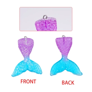 Resin mermaid tail pendants in purple blue gradient with glitter and metal rings