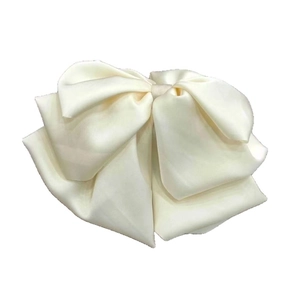 Elegant cream white satin bow hair claw clip with a layered French vintage aesthetic