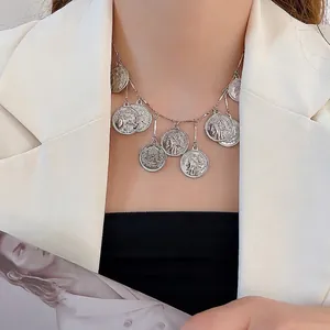Silver vintage multi-coin pendant necklace with portrait relief for women worn on neck