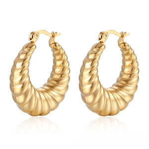Detail view of 18K gold plated hollow hoop earrings with thick ribbed croissant texture
