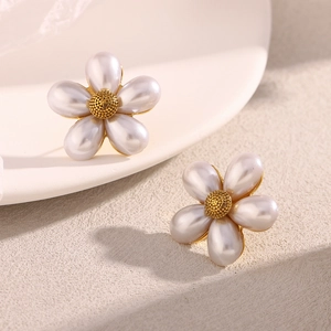 Detailed close-up of a floral earring featuring five pearl petals and a gold beaded center