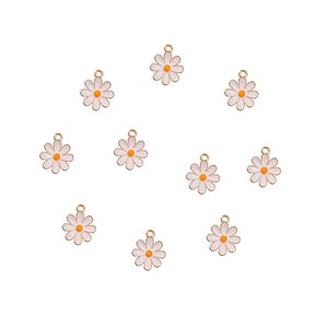 Detailed view of ten white daisy charms with orange centers and gold borders for DIY jewelry