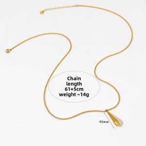 Detail of golden teardrop pendant necklace showing dimensions and mirror finish texture