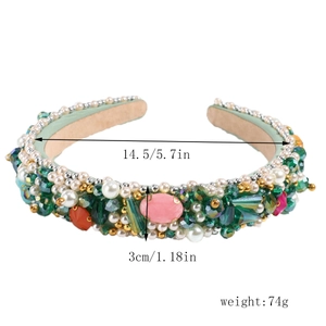 Detailed view of green baroque headband with colorful rhinestones and pearls measuring 3cm wide