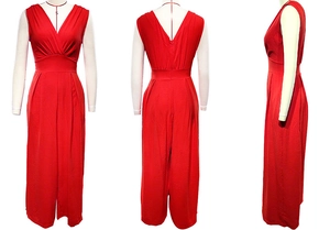 Three-way view of red sleeveless V-neck jumpsuit with high waist and wide-leg trousers