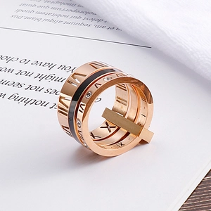 Three-in-one rose gold stainless steel ring with Roman numerals and black enamel