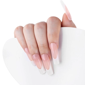 Long oval French press-on nails with transparent pink base and white tips on model