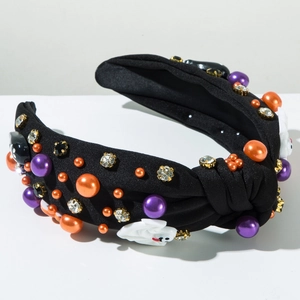 Detail eines Halloween-Knotenstirnbands mit Geistermotiven, Perlen und Strasssteinen