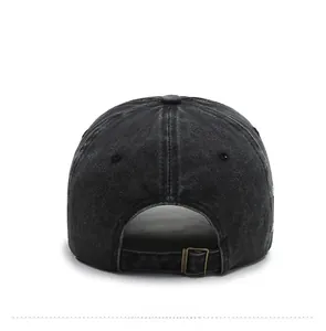 Rear view of washed black denim baseball cap with an adjustable bronze metal buckle