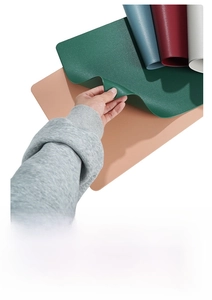 Close-up showing the flexible texture and heat-resistant layer of faux leather placemats